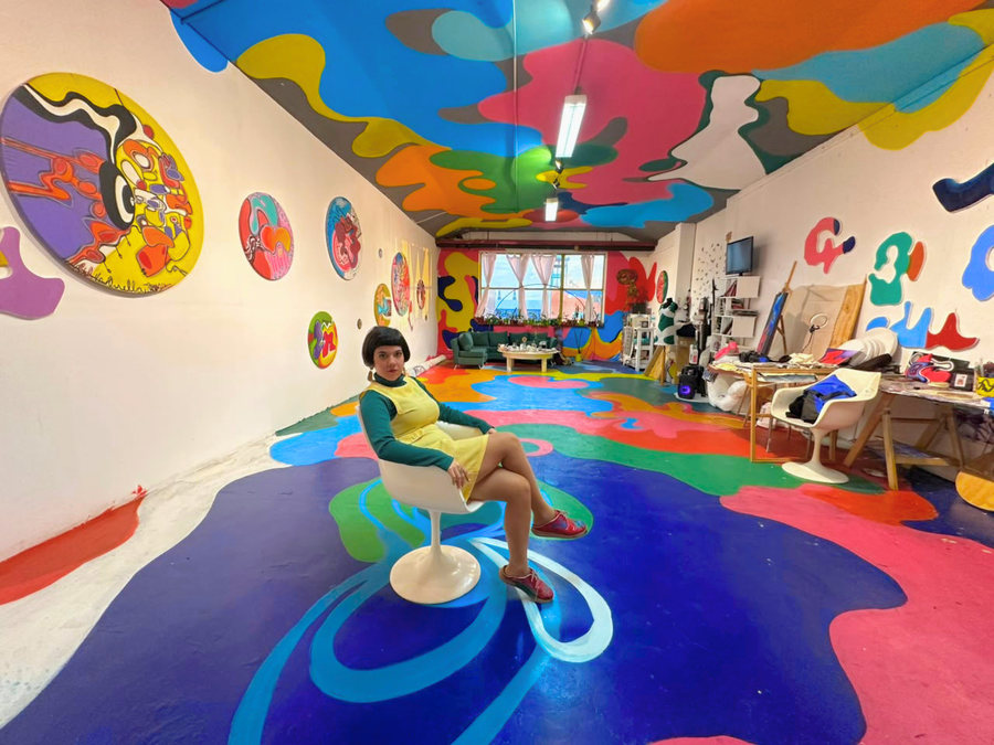 Ornella Ruiz Díaz in her Barracas studio, with floor, walls and ceiling painted in organic colour forms